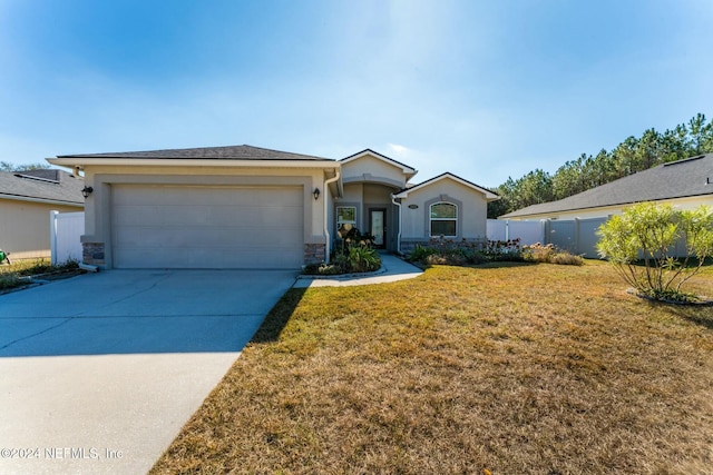 single story home with a front lawn and a garage