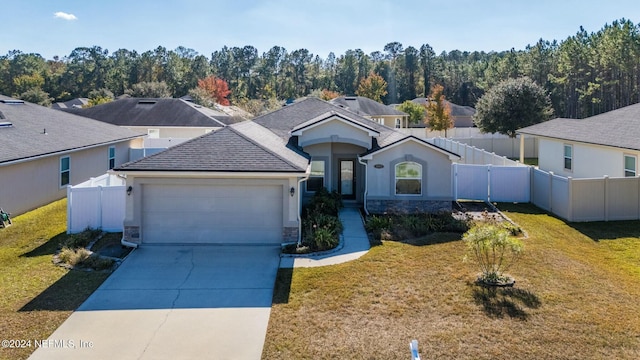 view of front of property with a garage and a front yard