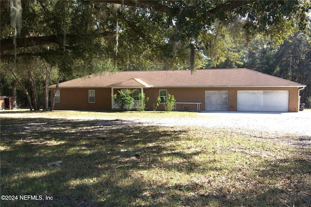 ranch-style home with a front yard