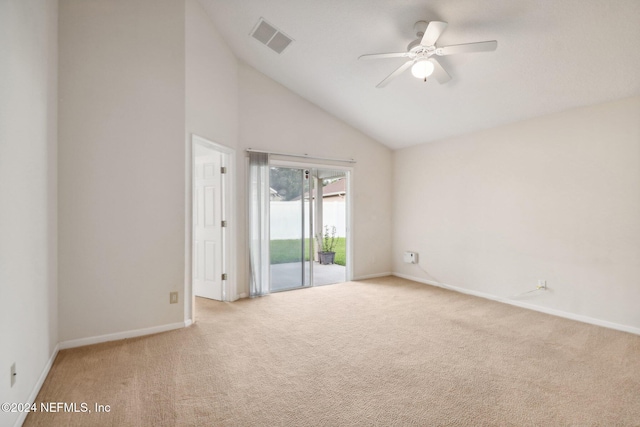 carpeted spare room featuring ceiling fan and high vaulted ceiling