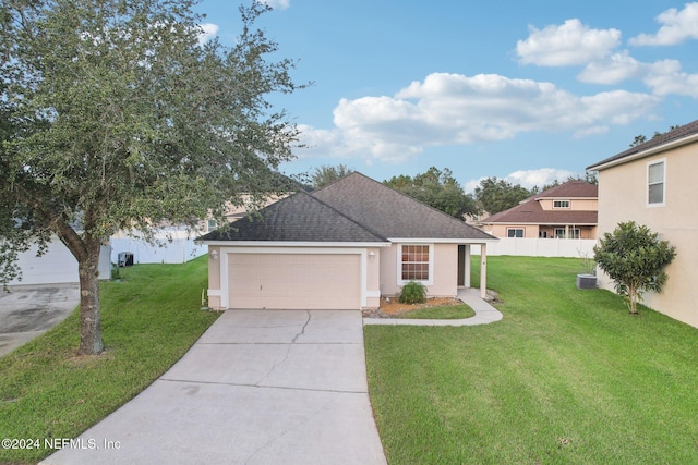 view of front facade featuring a front yard and a garage