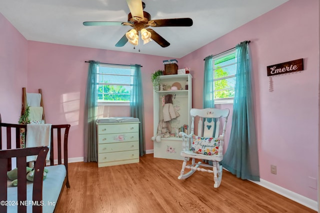 bedroom featuring light wood-type flooring and ceiling fan