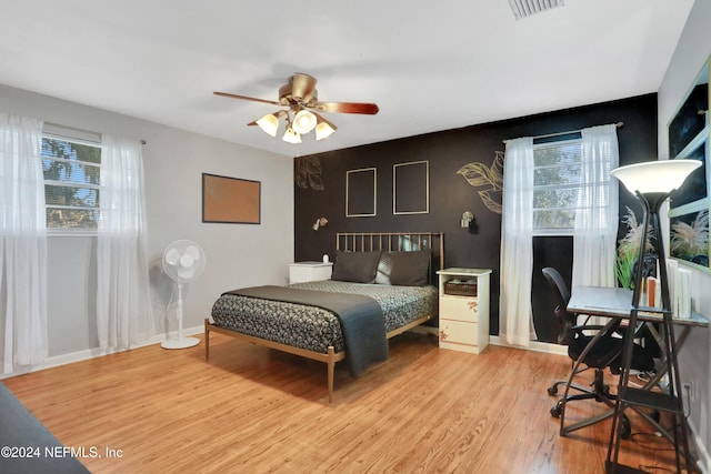 bedroom featuring hardwood / wood-style floors and ceiling fan