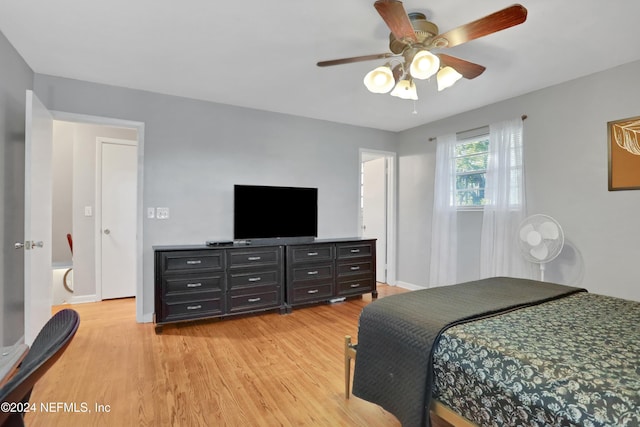 bedroom with ceiling fan and light hardwood / wood-style flooring