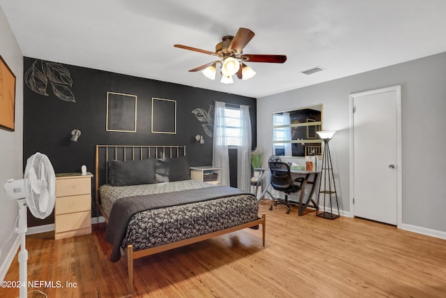 bedroom featuring ceiling fan and light wood-type flooring