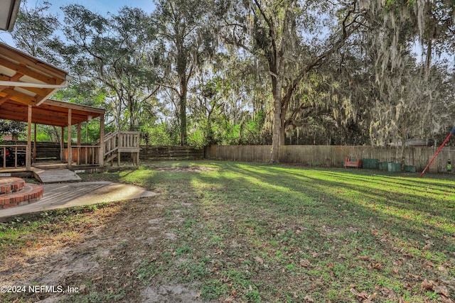 view of yard with a deck