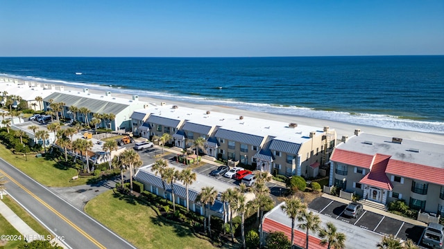 bird's eye view with a water view and a view of the beach