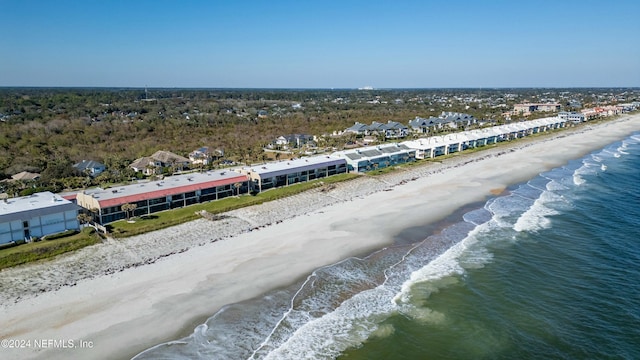 birds eye view of property with a view of the beach and a water view