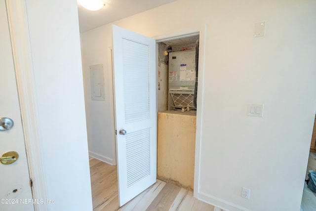 hall featuring electric panel and light wood-type flooring