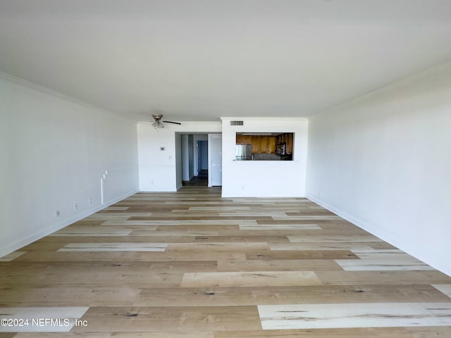 unfurnished room with ceiling fan, light hardwood / wood-style floors, and crown molding