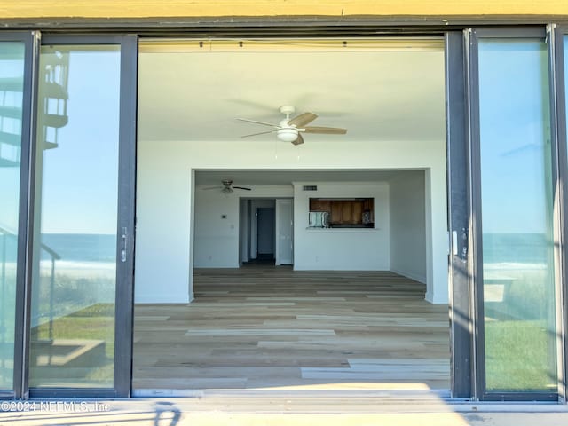 property entrance with ceiling fan