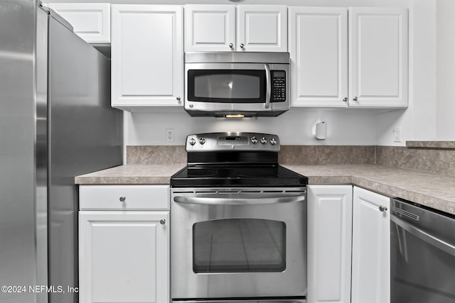 kitchen featuring white cabinets and stainless steel appliances