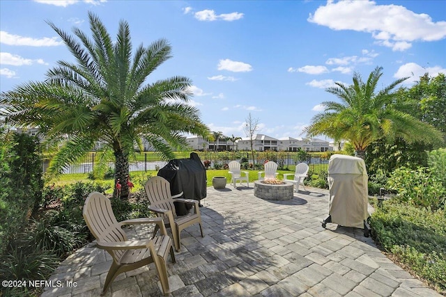 view of patio featuring a grill and an outdoor fire pit