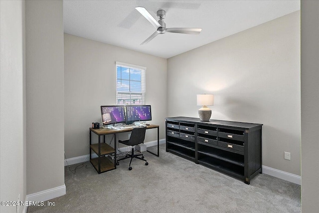 office featuring light carpet and ceiling fan