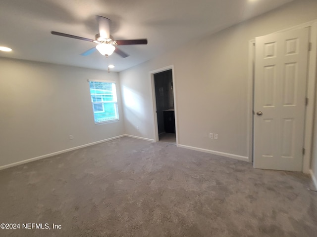 unfurnished room with carpet flooring and ceiling fan