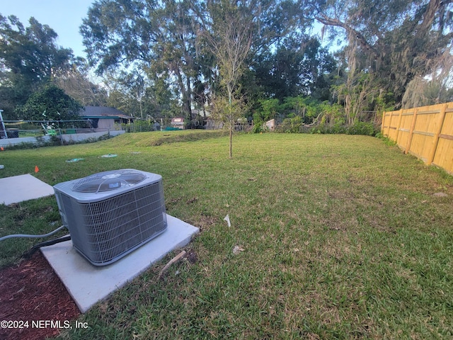 view of yard with central AC