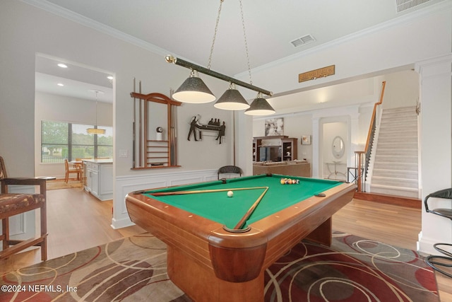 rec room with light wood-type flooring, crown molding, and billiards