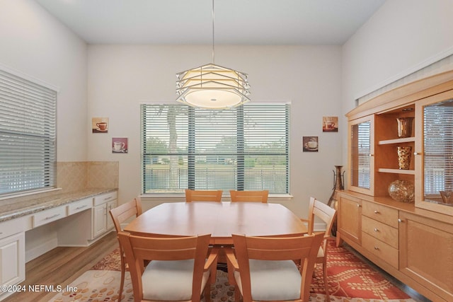 dining space with light wood-type flooring