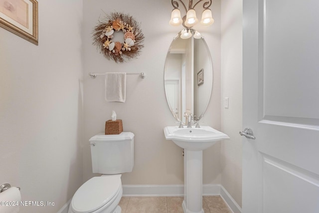 bathroom with tile patterned floors, sink, and toilet