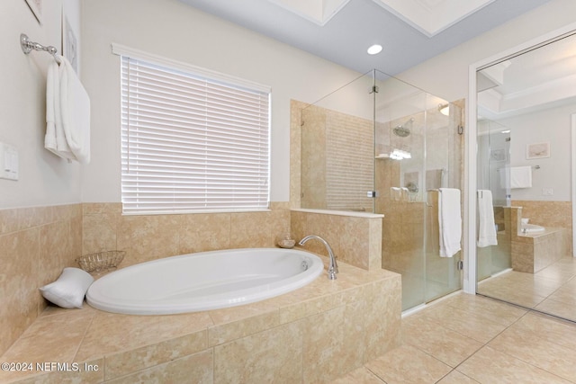 bathroom featuring tile patterned floors and shower with separate bathtub