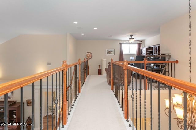 hallway featuring carpet flooring