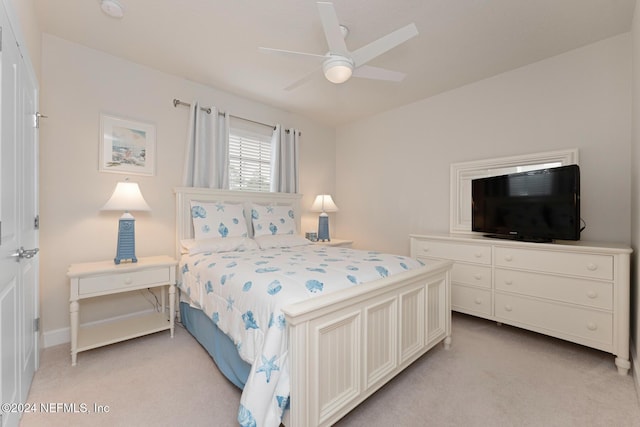 bedroom featuring ceiling fan and light colored carpet