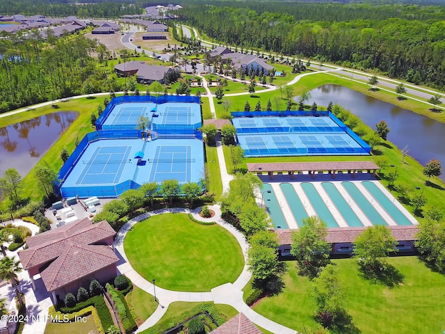 birds eye view of property with a water view