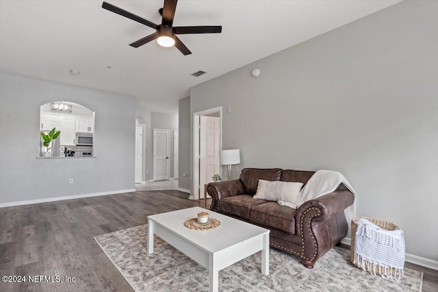 living room featuring hardwood / wood-style flooring and ceiling fan