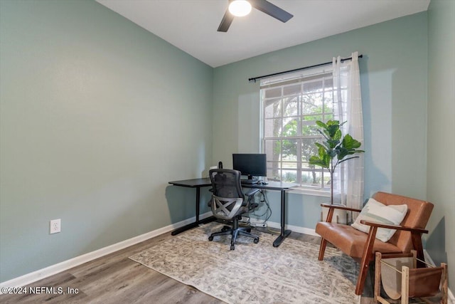 home office with hardwood / wood-style floors and ceiling fan