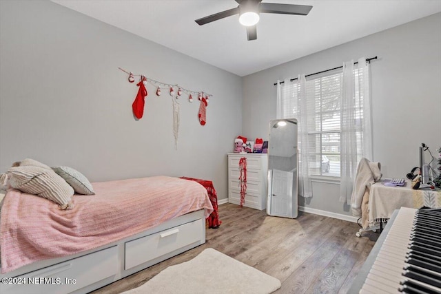 bedroom featuring light hardwood / wood-style flooring and ceiling fan