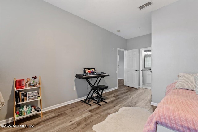 bedroom featuring wood-type flooring