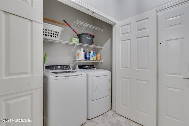 washroom featuring washing machine and dryer