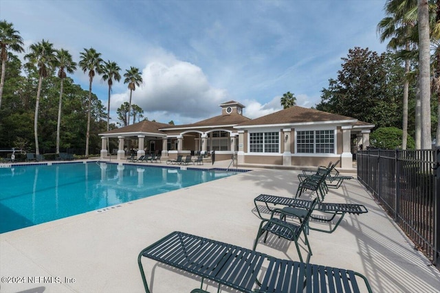 view of swimming pool with a patio area