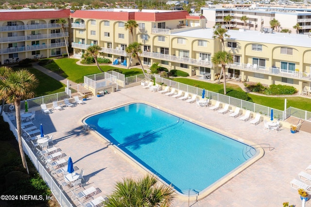 view of swimming pool featuring a patio area