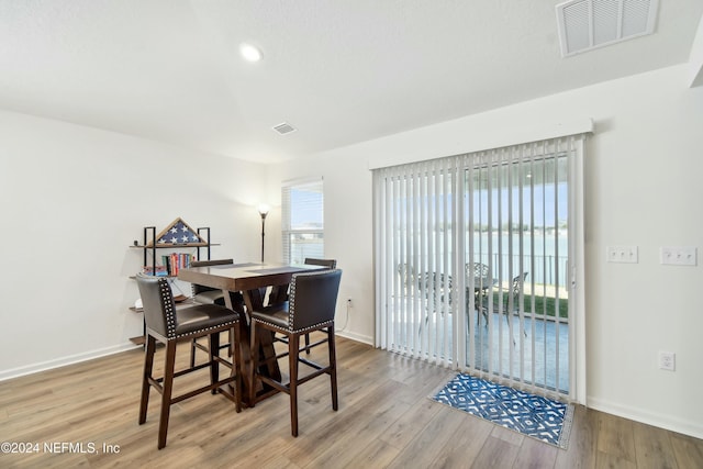 dining space featuring wood-type flooring