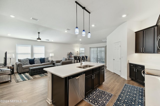 kitchen with a kitchen island with sink, sink, ceiling fan, light hardwood / wood-style floors, and stainless steel appliances