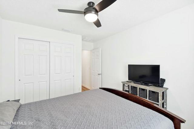 bedroom featuring ceiling fan and a closet