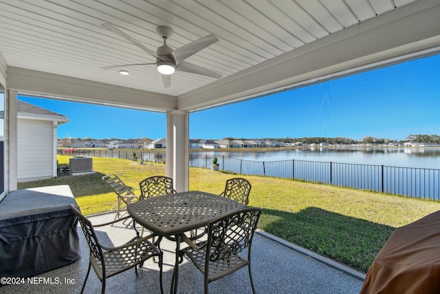 view of patio / terrace with area for grilling, ceiling fan, a water view, and central AC