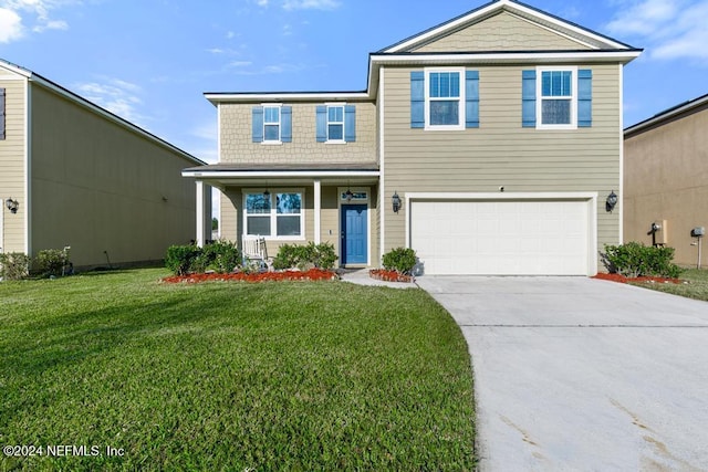 view of property with a front lawn and a garage