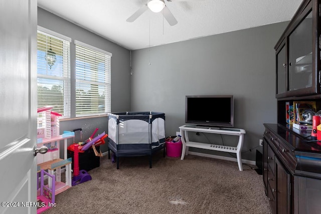 recreation room featuring carpet flooring and ceiling fan