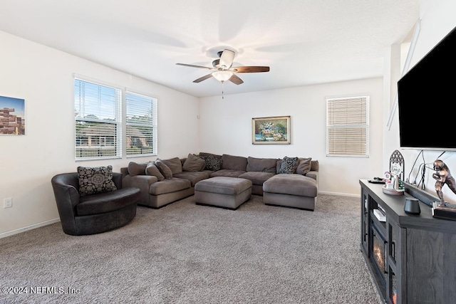 carpeted living room featuring ceiling fan