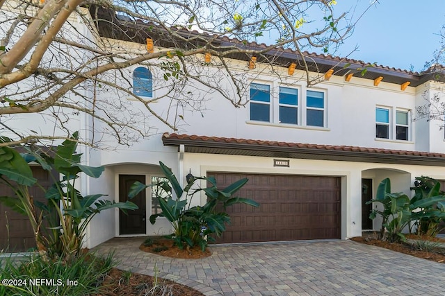 mediterranean / spanish-style house featuring a garage