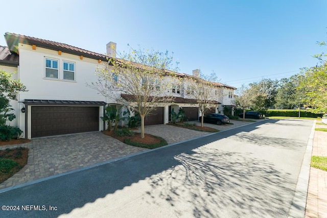 view of front of home with a garage