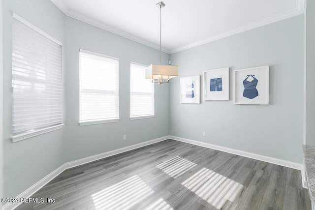 unfurnished room featuring crown molding and hardwood / wood-style flooring