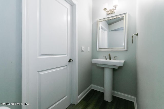 bathroom with hardwood / wood-style flooring