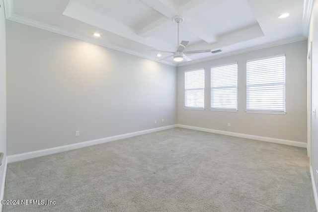 unfurnished room with ceiling fan, light colored carpet, and ornamental molding