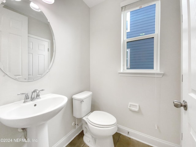 bathroom with tile patterned floors, sink, and toilet