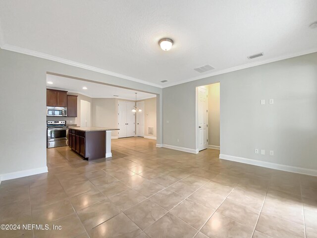 unfurnished living room with crown molding and an inviting chandelier