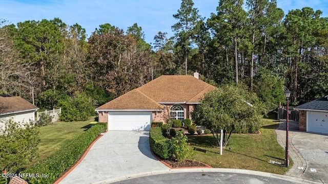 view of front of house with a front lawn and a garage