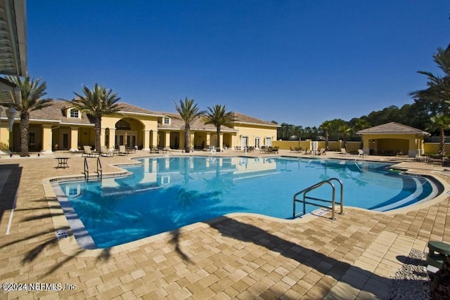 view of swimming pool featuring a patio area